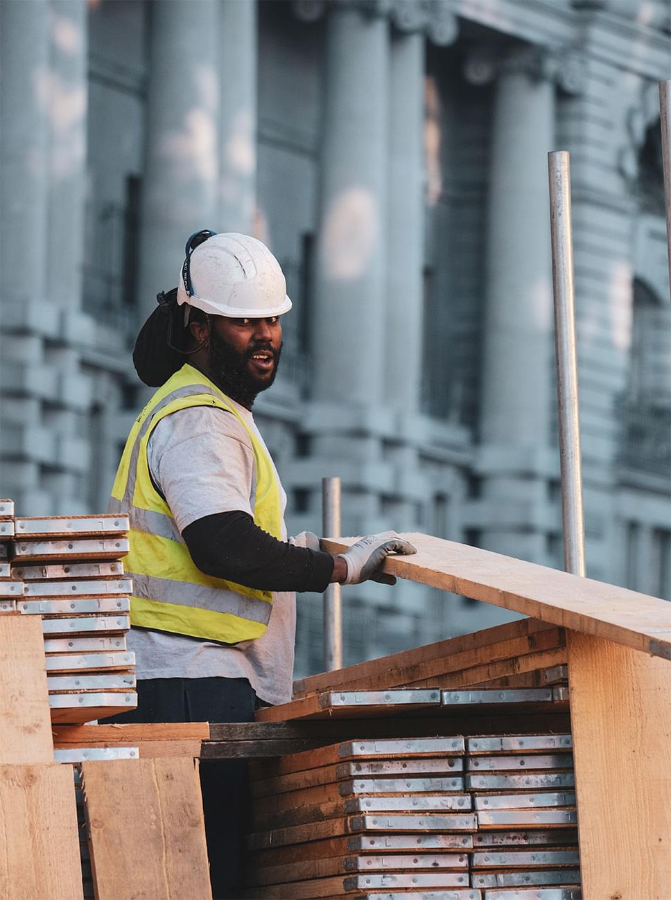 Construction worker on site with helmet