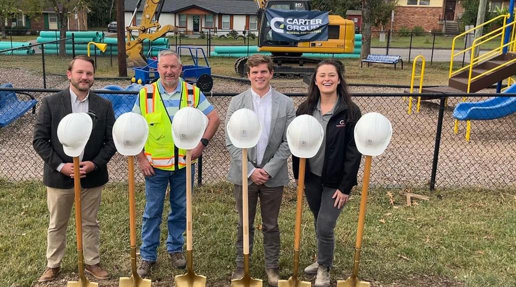 Carter Group team with shovels and helmets